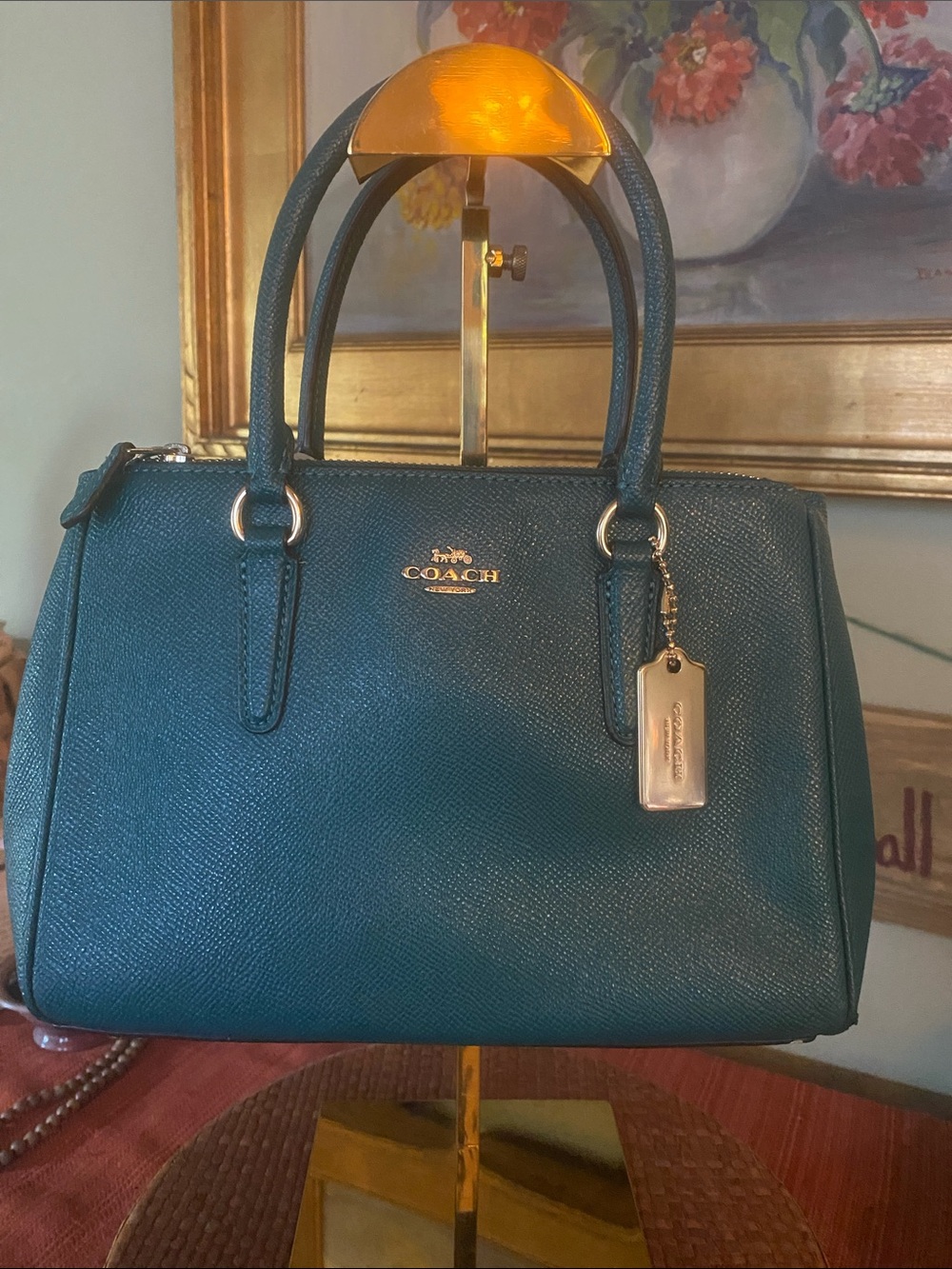 Coach Mini Surrey Teal Carryall with crossgrain leather and gold-toned hardware.